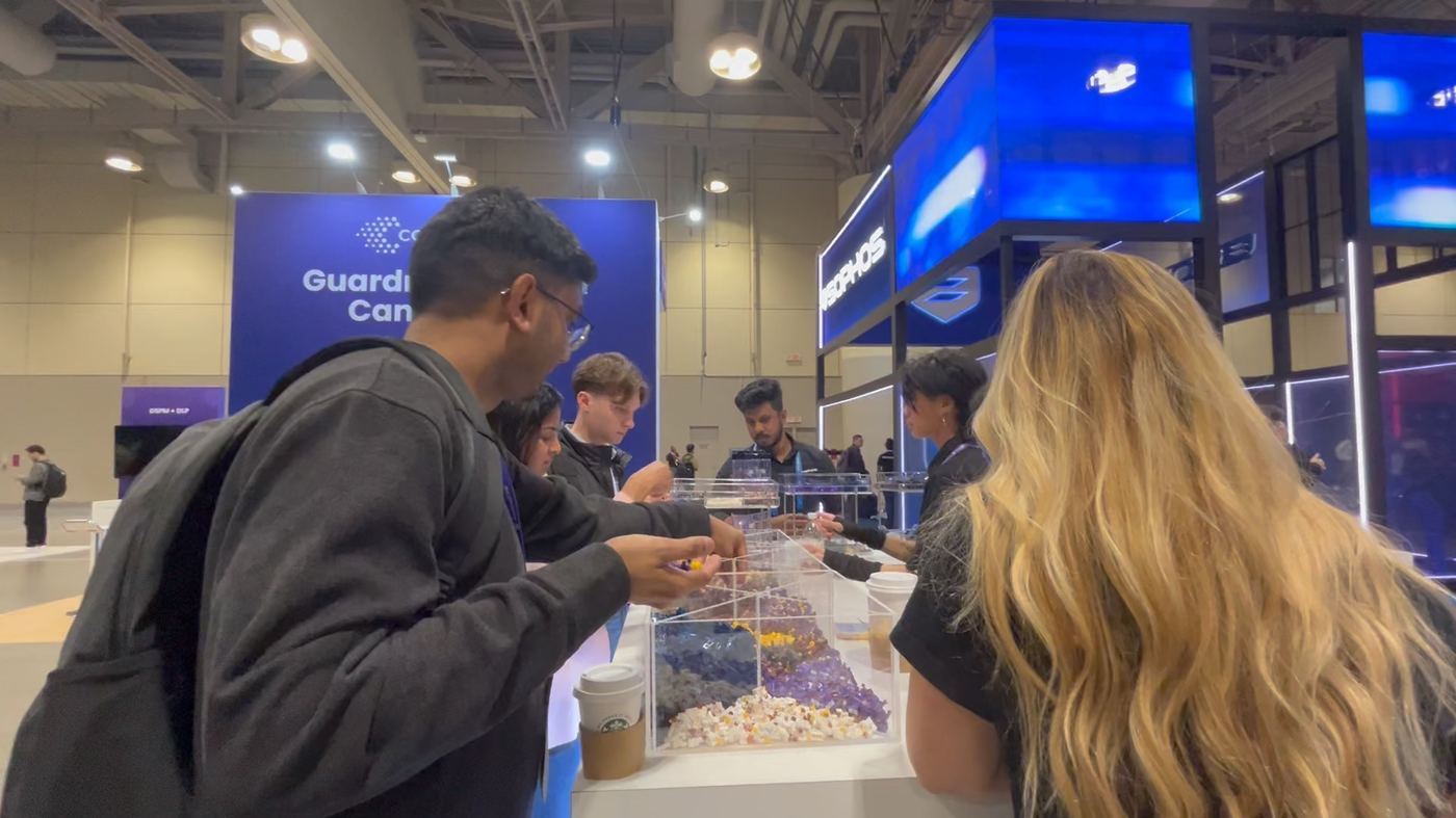 Attendees building LEGO minifigures at the booth on the SecTor 2026 floor.